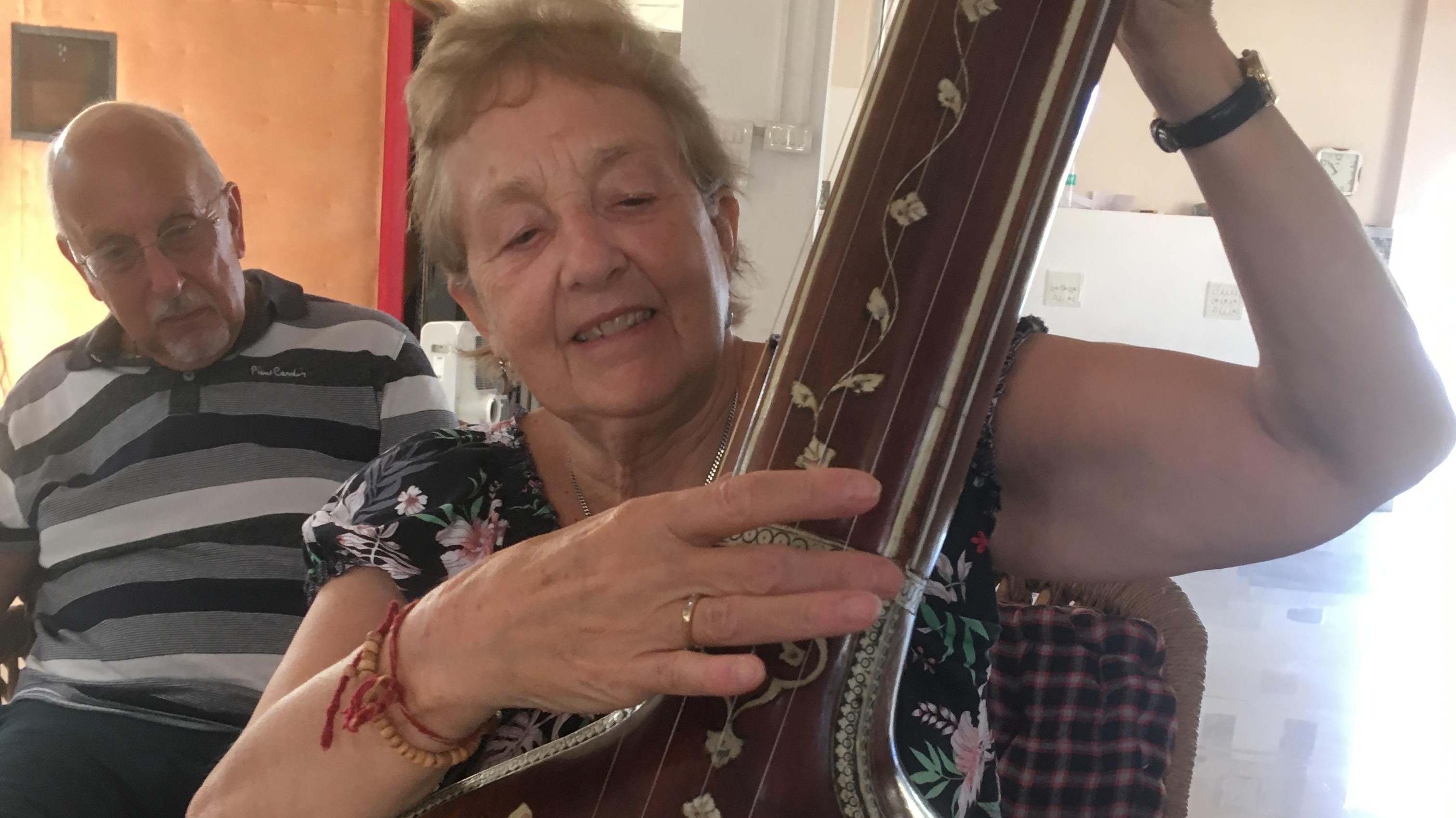 Maggie playing an instrument.