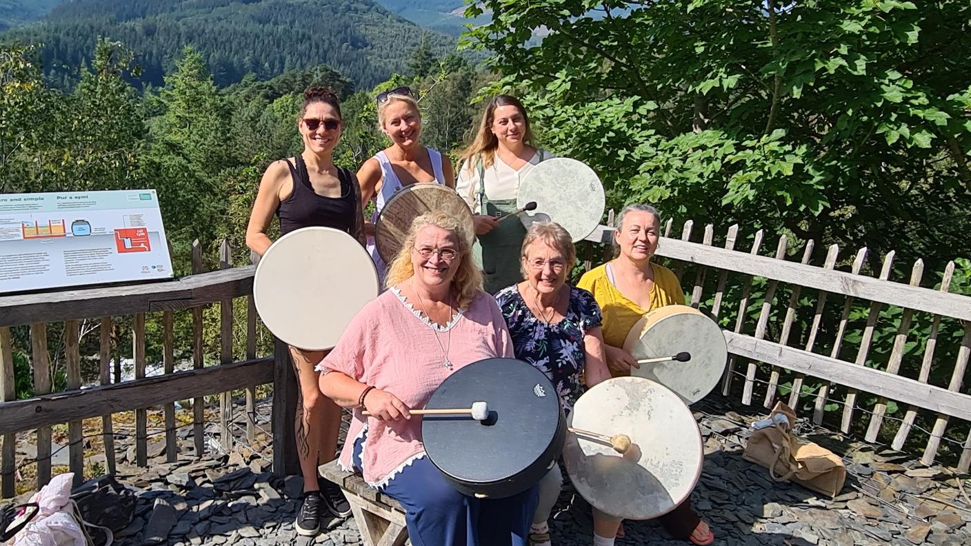 Maggie with a drumming group.